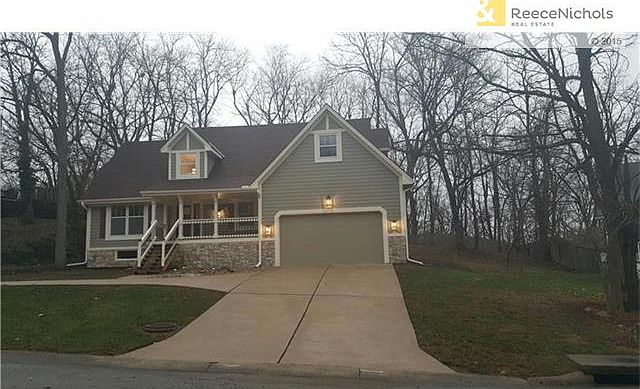 Craftsman Style house on treed lot. All new outside lighting.  Enjoy a drink on the front porch