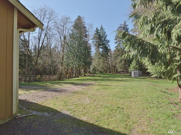 Walking into your park like setting of what you now call your back yard. Double sheds for storage. You have so much room to roam