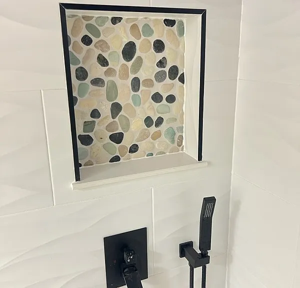 Close up of the bath tile and shower in main bathroom.