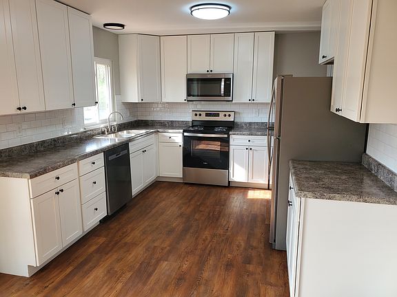 Updated Kitchen, new flooring, new cabinets, counter tops and Stainless steal appliances.