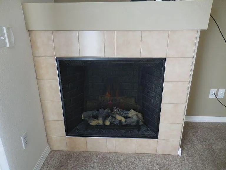 Electric fireplace with remote control also provides extra heat option on remote.