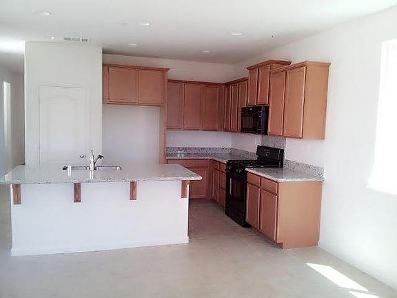 Kitchen with appliances and upgraded island