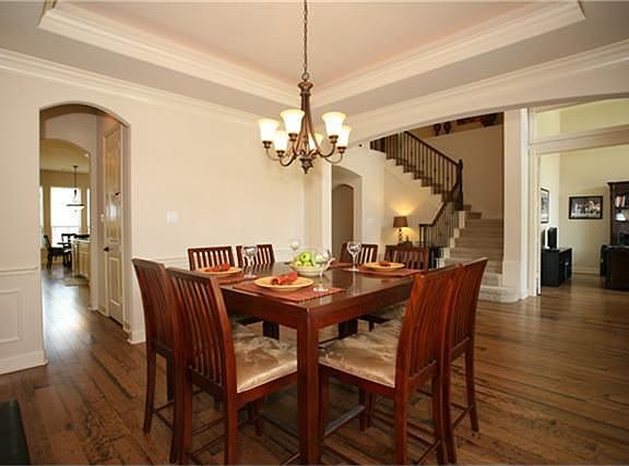 Formal dining is spacious and has chandelier and good walls for china cabinets or buffets.
