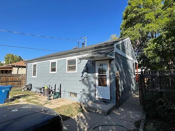 back of house showing separate backdoor entrance and back gate entrance