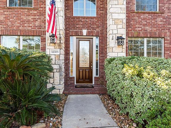 The front elevation with brick and stone make for an inviting and grand entry.