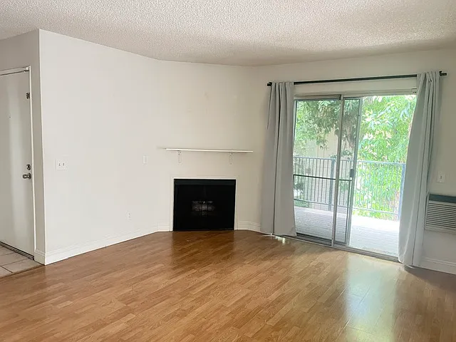 Balcony. Living room w fireplace. Gas is provided free.