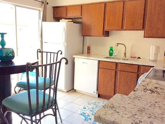 Full size open country kitchen, AND hard to find a condo with lots and lots of cabinets.