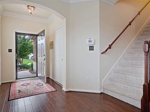 This bright and welcoming entry is sure to make both you and your guests feel right at home. The added bonus of a Lawson storm door allows you to keep the front door open and enjoy the view of your beautifully landscaped front yard.