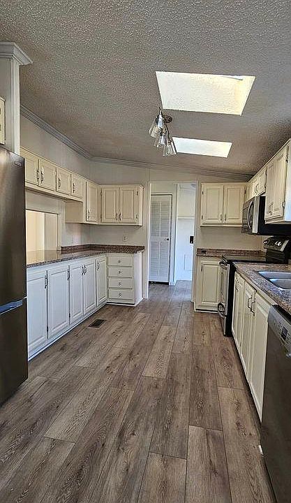 Updated kitchen with granite countertops, breakfast bar and brand new refrigerator and Bosch dishwasher.