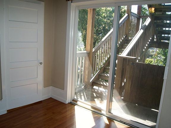 Living room face SouthEast - stairs to shared yard