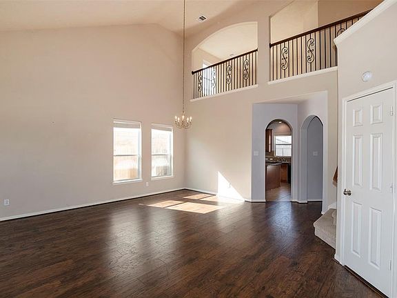 As you enter the home you are welcomed with soaring ceilings and gorgeous flooring.