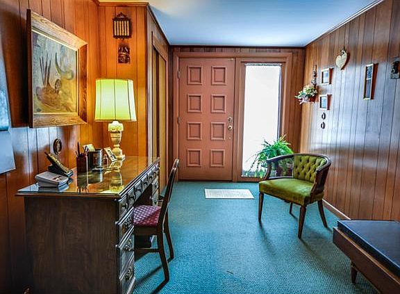 Wide entrance foyer reveals half bath & 5th bedrm.