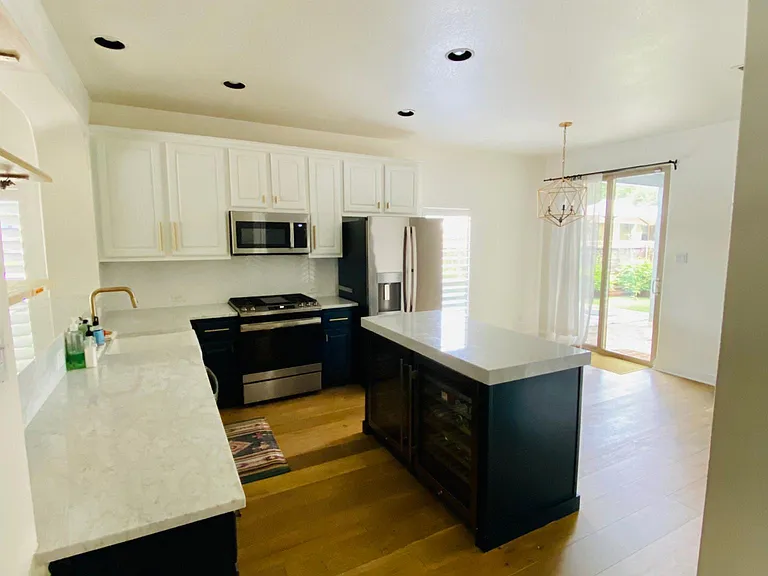 Kitchen with upgraded stainless steel appliances and marble countertops