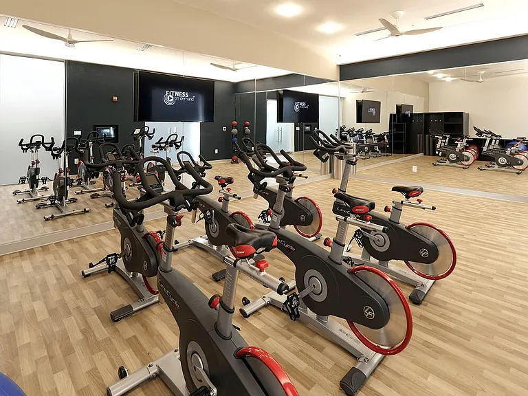 Fitness studio with spin bikes and Fitness on Demand programming