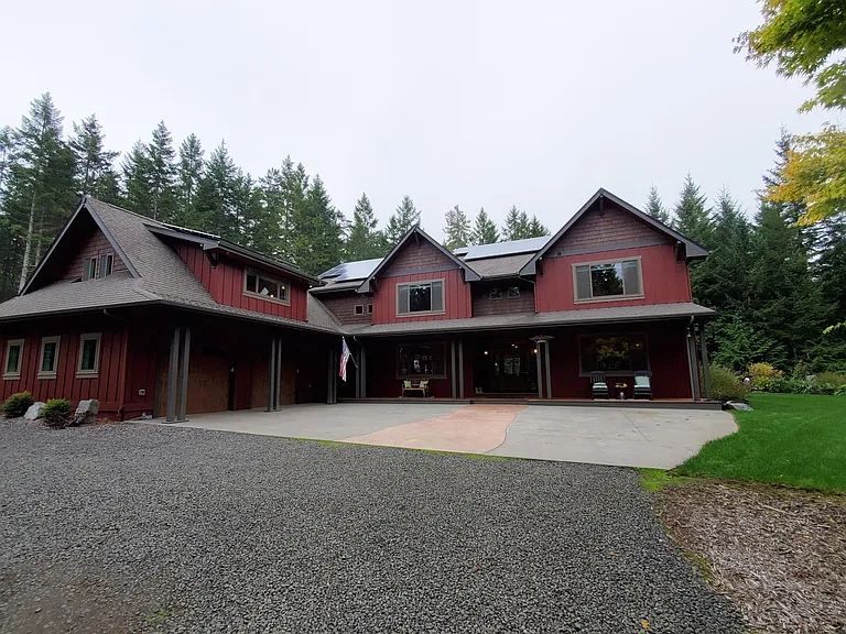 The front of the home has an oversized 2 car garage and large concrete parking area.