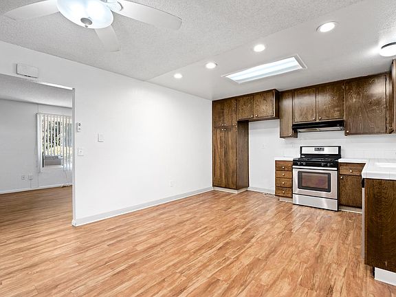 New hardwood throughout large kitchen with newer appliances. (Refrigerator not included.)