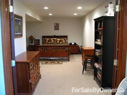 Lower Level Bonus Room : French doors lead to potential 5th bedroom, office space or storage area.