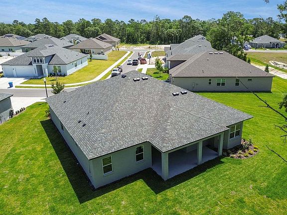 Strabane new construction quick move-in elevated rear left angled view 1143 Kelsa Anne Dr in Spring