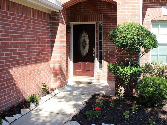 Entry with leaded glass front door.