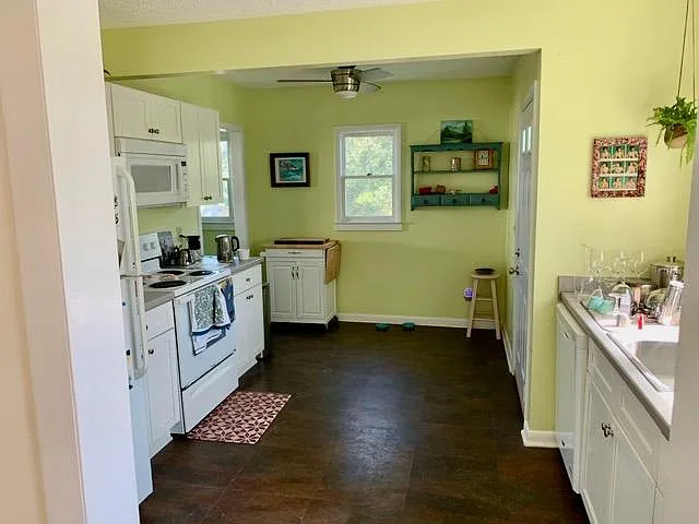 The kitchen looking towards the back of the house. The laundry room is off the kitchen to the left.