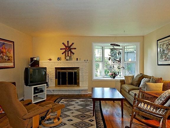 Newly Refinished Hardwood Floors Punctuate this Living Room