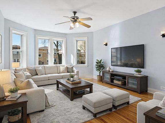 Large living room. This is a picture of the same unit on the 3rd floor. This subject apartment has a faux stone fireplace.