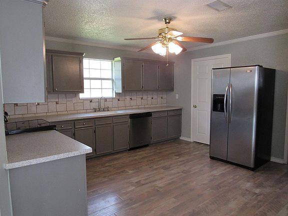Kitchen has new paint, corian counters refrigerator included.
