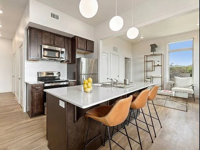 High ceilings, modern lighting, ample kitchen storage High ceilings, modern lighting, ample kitchen storage