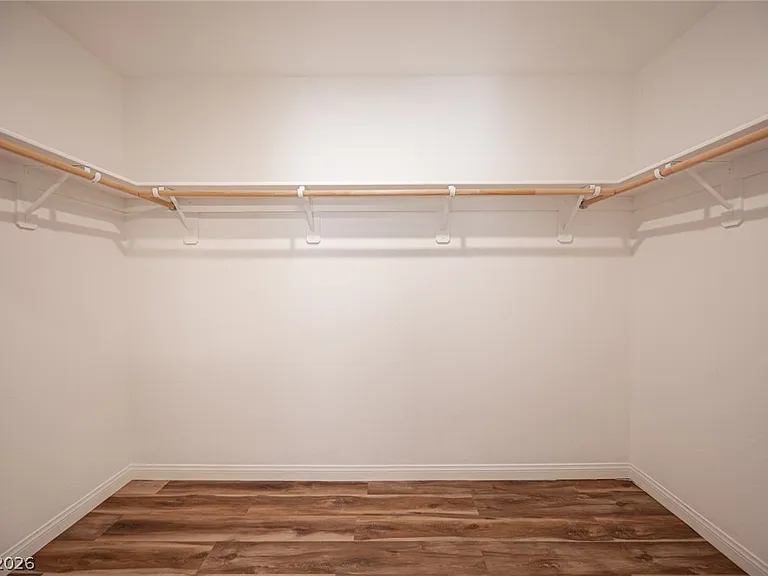 Walk-in closet: Generous primary walk-in closet.