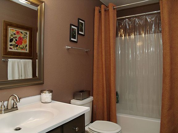 2nd Bathroom with Brushed Steel Faucet and Light Fixture