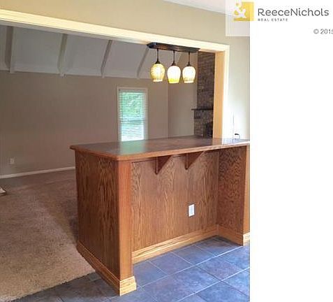 Kitchen has breakfast bar.  Opens to Great Room.