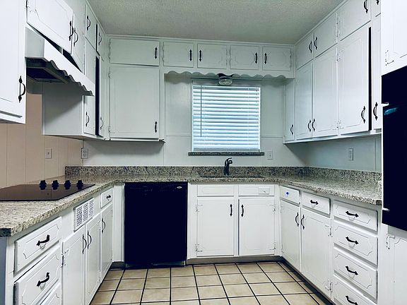 Kitchen with updated countertops and plumbing