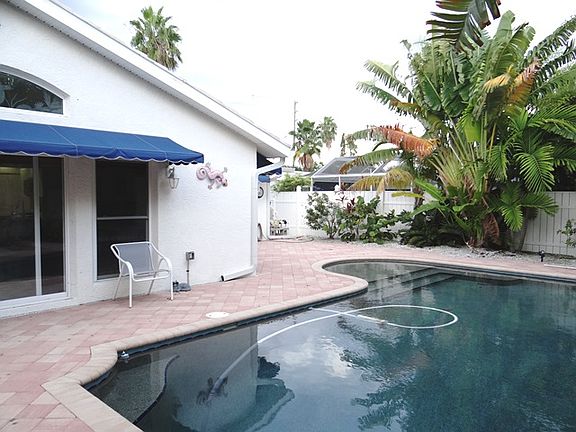 pebble-tech pool and pavers