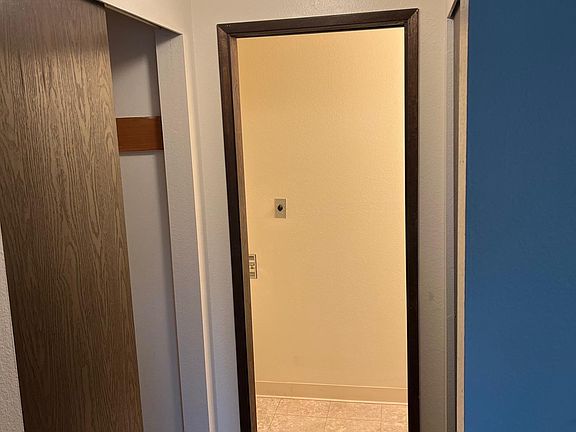 Hallway to half bathroom