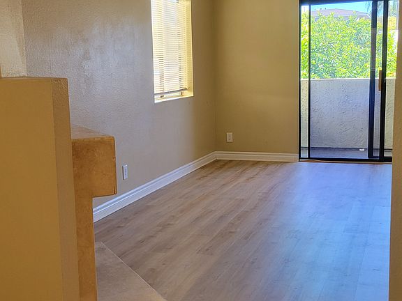 Corner unit with extra windows and sliders to balcony.