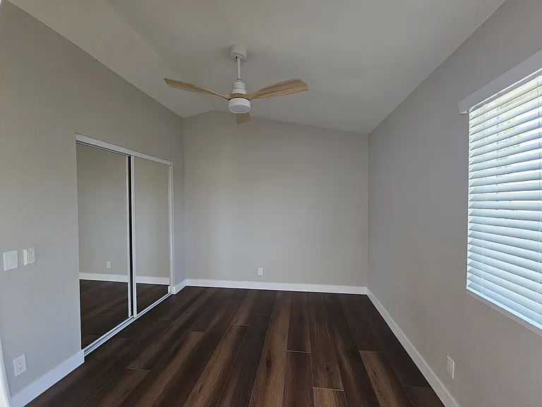 Bedroom with mirrored closet doors