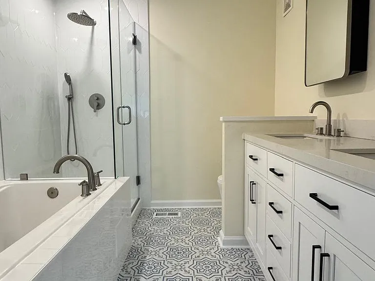 Master Bath with new vanity, shower, tile, toilet.