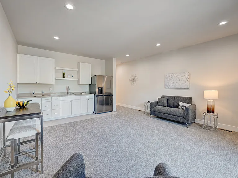 Third Floor Entertainment Room with Wet Bar, Refrigerator and Access to Large Deck