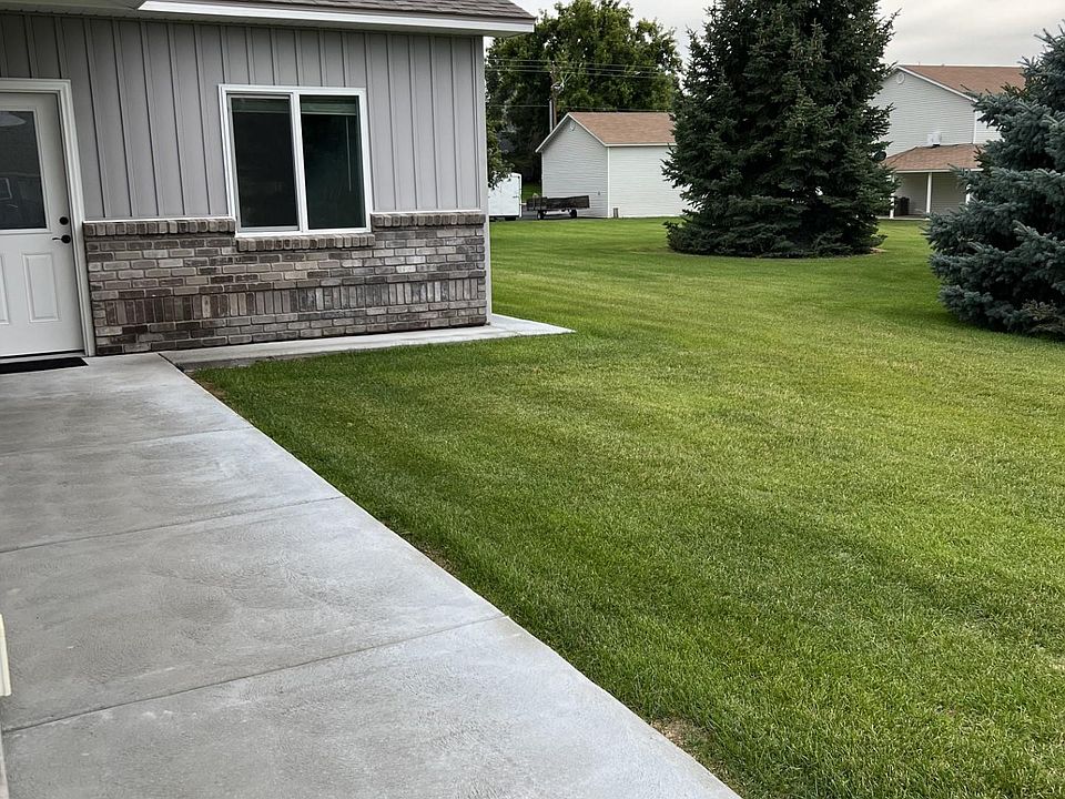 Front entrance and side lawn