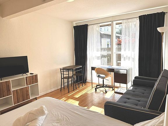 Bedroom 2 with no patio access. Pictured as currently furnished