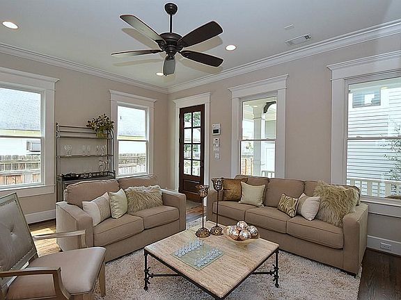 Bright living area looks onto courtyard. The video/intercom system at door allows you to buzz in visitors. You may also see and allow visitors access from your smart phone.