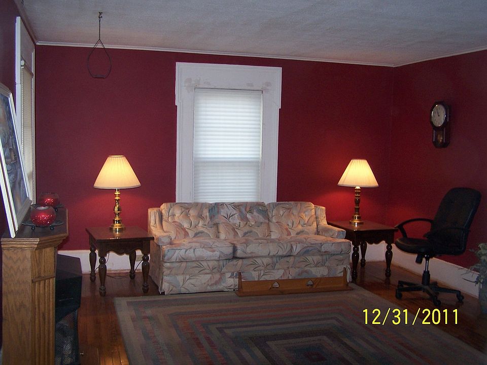 The livingroom is no longer red, it is beige