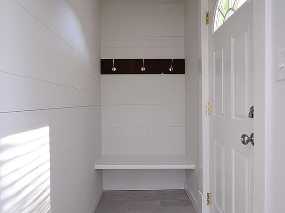 Entry - Tile floor with bench seat and coat hooks