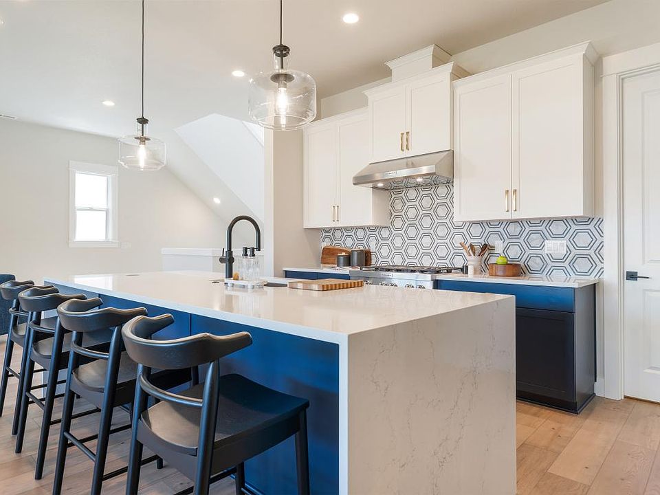 Open-concept kitchen with large island and a breakfast bar