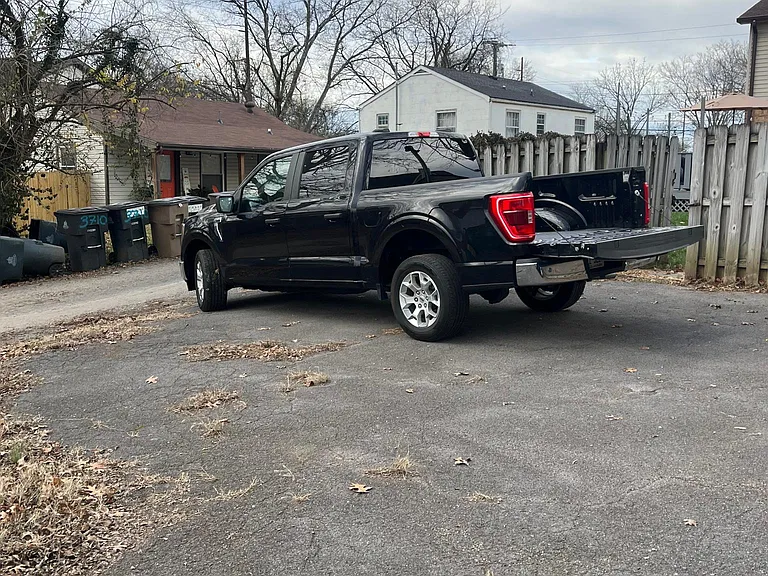 Paved parking space behind back fence. Should be large enough for two vehicles.