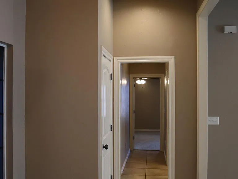 Front entrance closet/hallway to primary bedroom. Split floor plan.