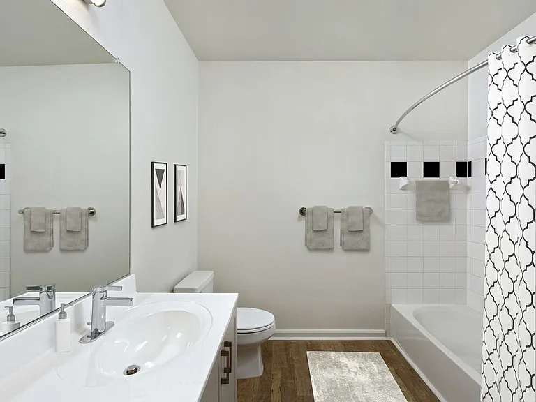 Renovated II bathroom with white cultured marble countertop and hard surface flooring