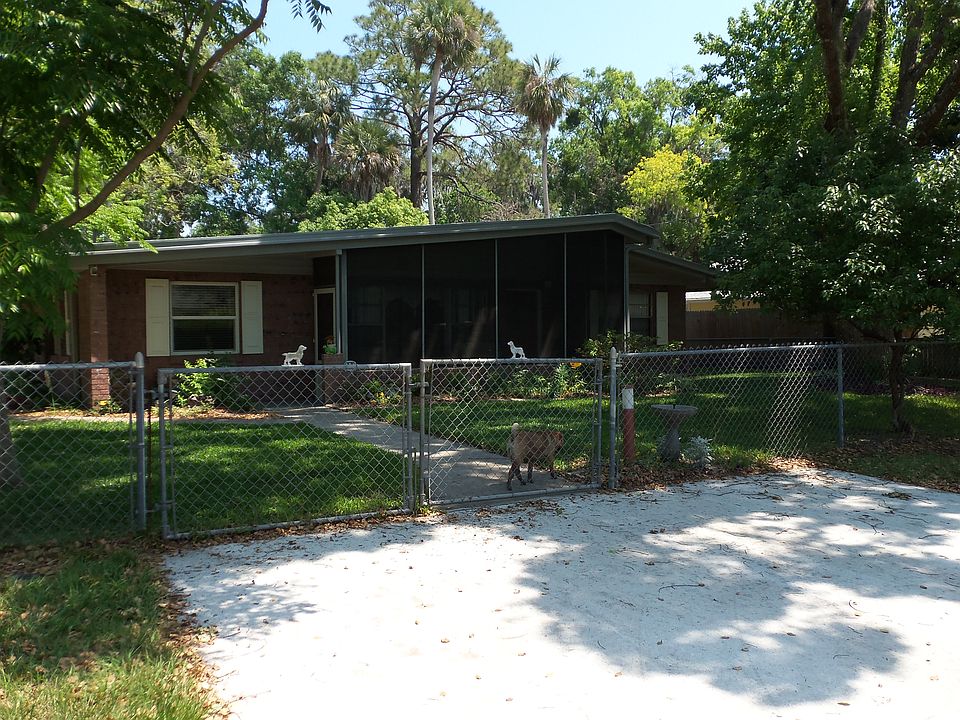 Front of house with screened porch