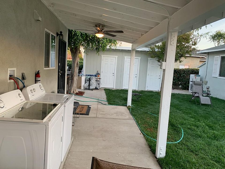 Notice the washer dryer. Nice place to sit and relax in the evenings. 
Storage rooms..... one for each unit. Parking next to the house at the end. Also, Bar-B-que next to the storage rooms