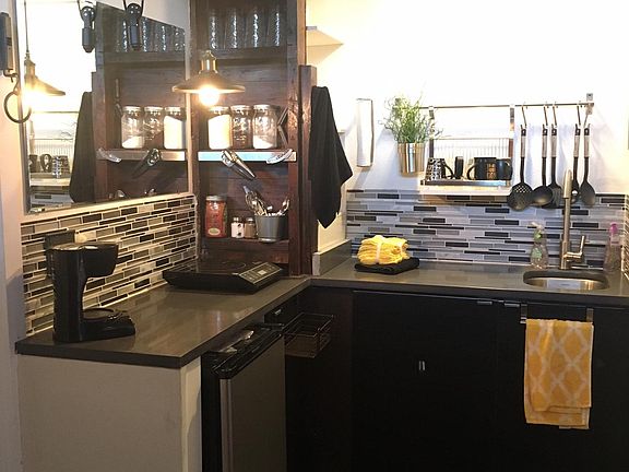 Kitchen has no dishwasher/disposal or oven. Single cooktop, toaster & coffee maker for the equally simple lifestyle.